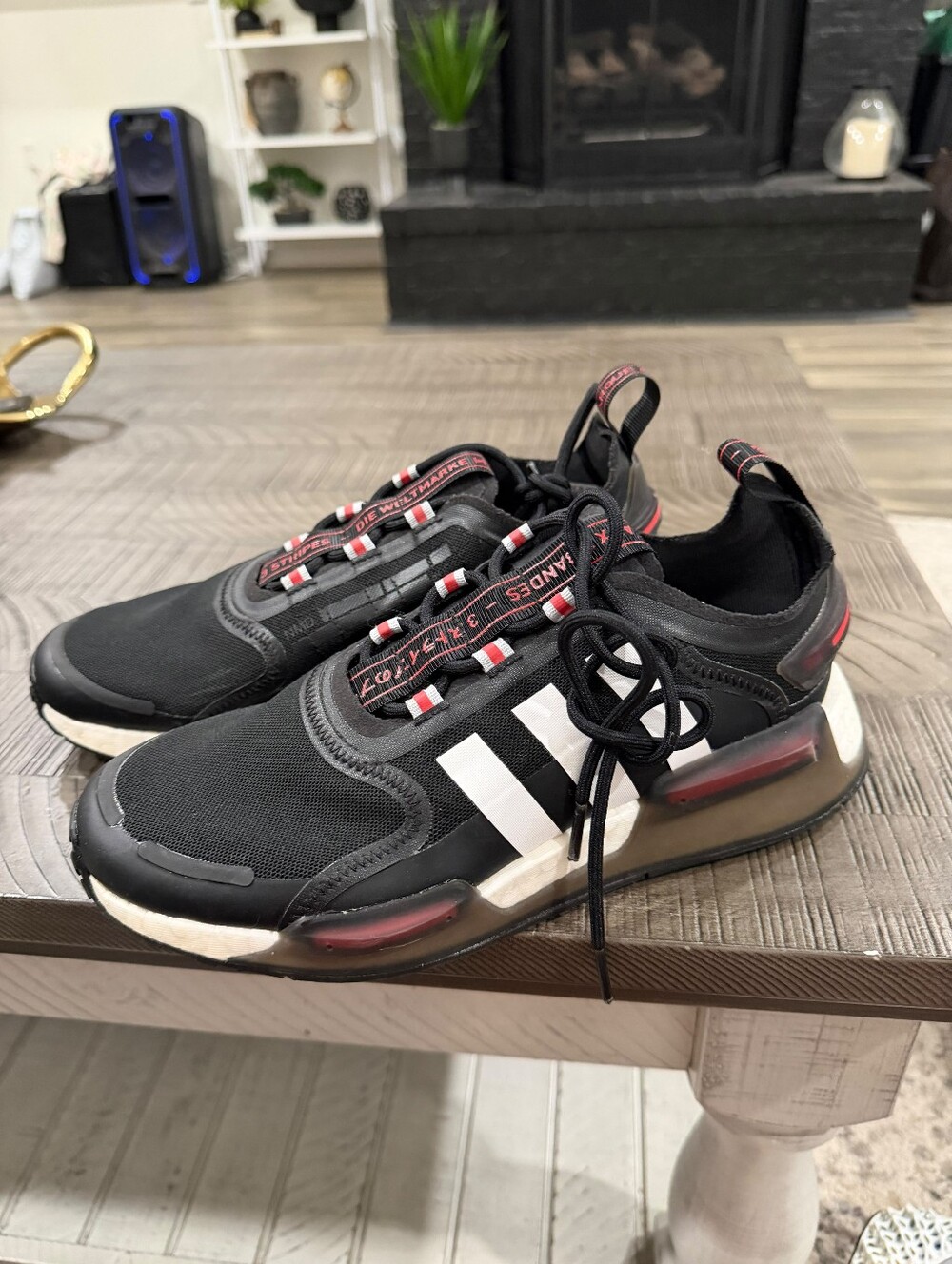 Adidas Black Athletic Sneakers with White Stripe and Red Accents
